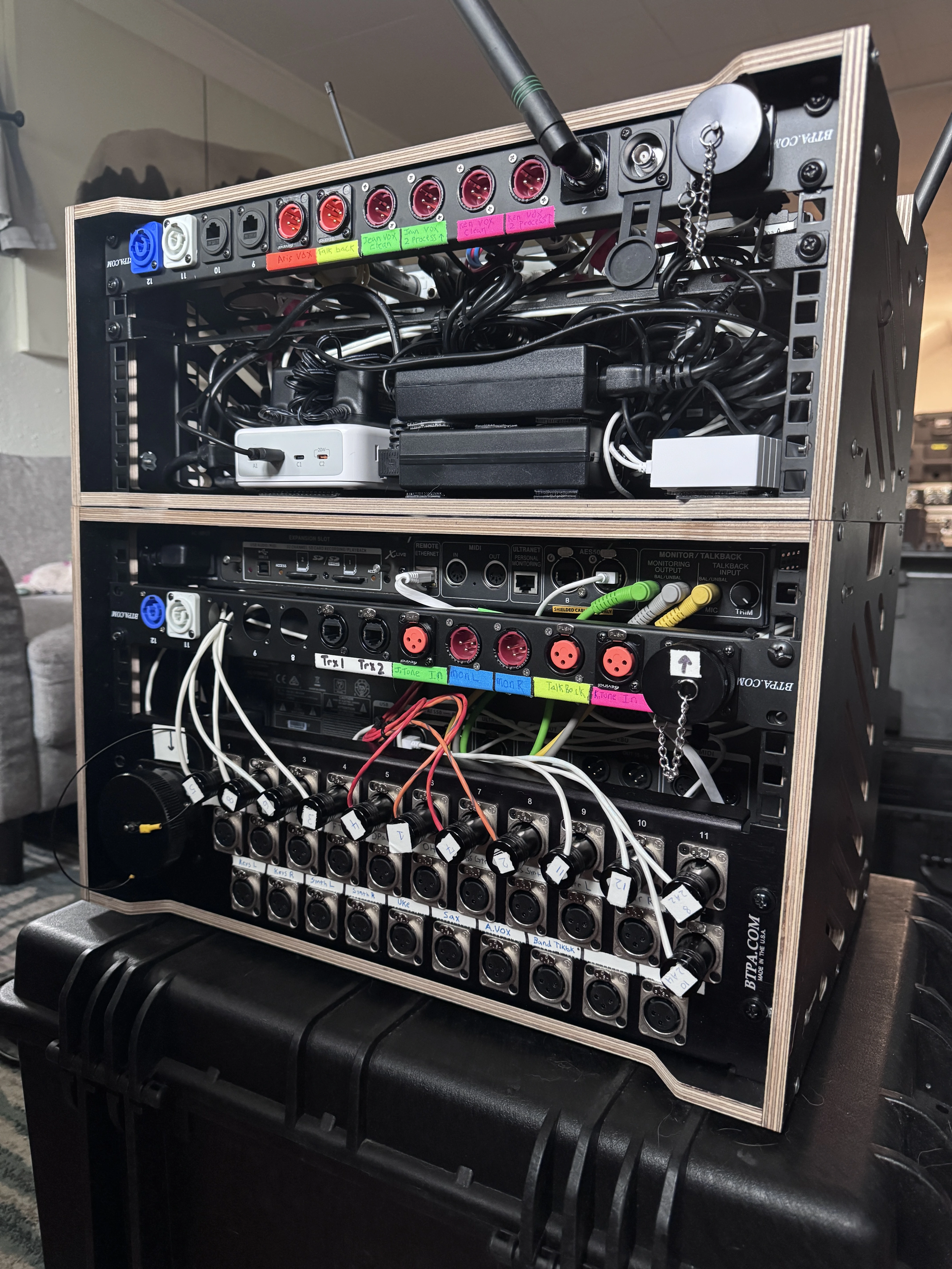 IEM rig front — wireless receivers, transmitters, Furman power, labeled patch panel