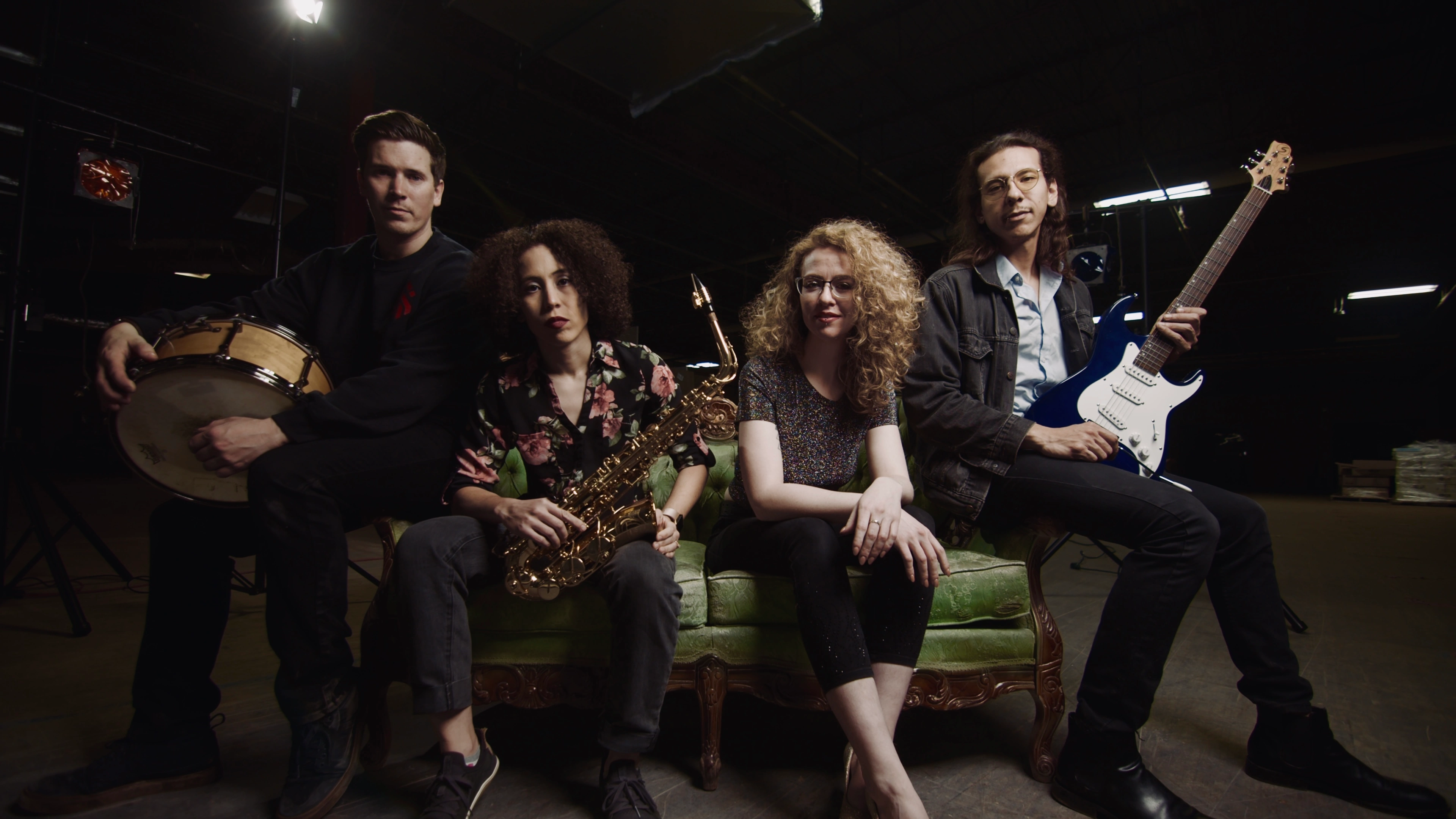 On the green couch with instruments